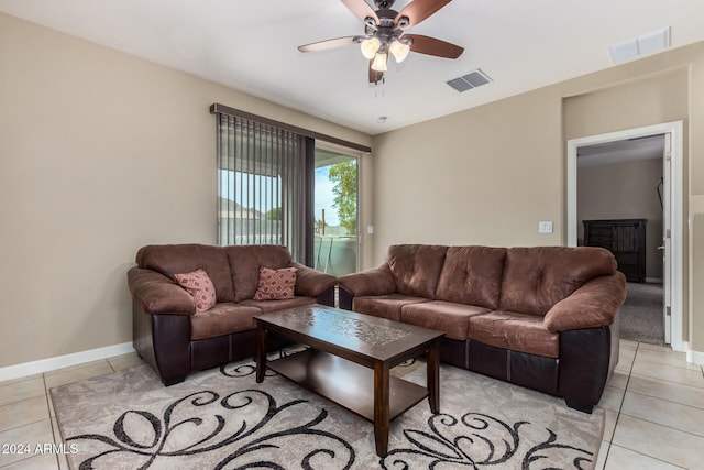 tiled living room featuring ceiling fan