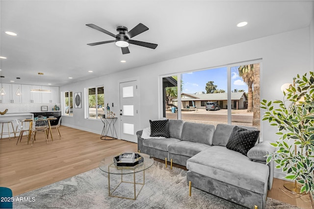14635 N 37th Pl, Phoenix, AZ 85032 - living area featuring light wood-style floors, healthy amount of natural light, recessed lighting, ceiling fan, and baseboards