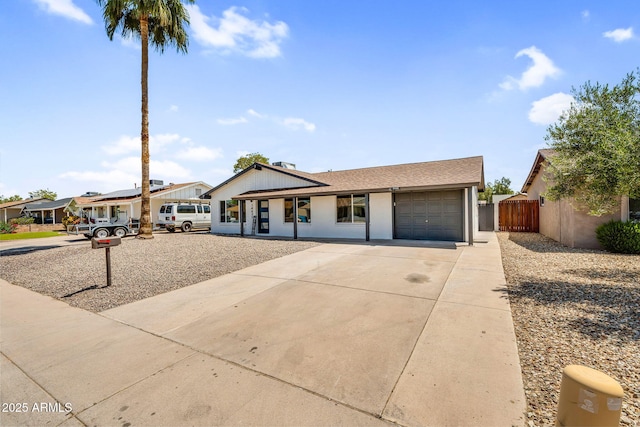 14635 N 37th Pl, Phoenix, AZ 85032 - view of front of property with an attached garage, fence, and concrete driveway