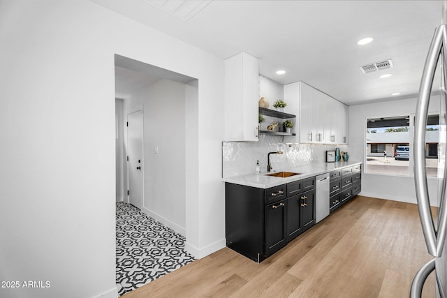 14635 N 37th Pl, Phoenix, AZ 85032 - kitchen featuring dark cabinetry, dishwasher, open shelves, a sink, and white cabinetry
