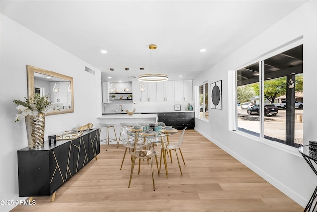 14635 N 37th Pl, Phoenix, AZ 85032 - dining space featuring light wood-style flooring, recessed lighting, and baseboards