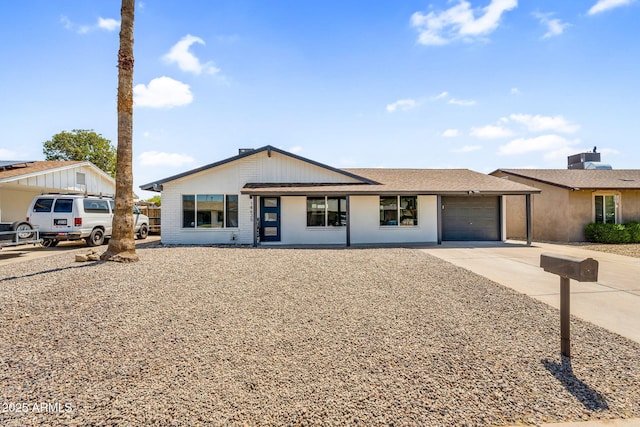14635 N 37th Pl, Phoenix, AZ 85032 - view of front of home with concrete driveway, an attached garage, and brick siding