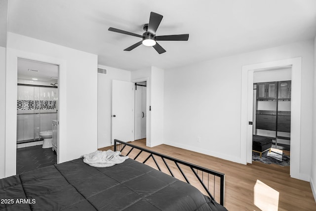 14635 N 37th Pl, Phoenix, AZ 85032 - bedroom with wood finished floors, baseboards, ensuite bath, and ceiling fan