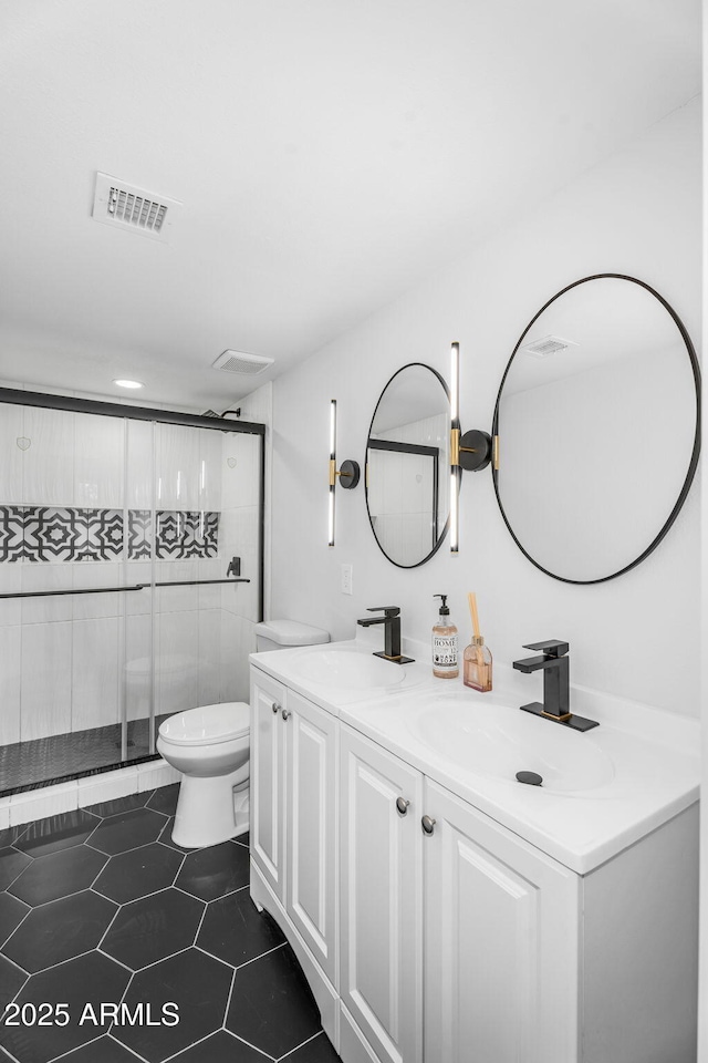 14635 N 37th Pl, Phoenix, AZ 85032 - full bath featuring tile patterned floors, toilet, double vanity, and a stall shower