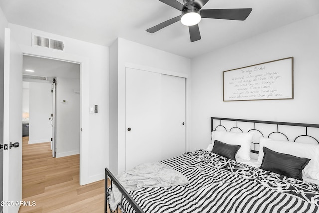 14635 N 37th Pl, Phoenix, AZ 85032 - bedroom featuring a closet, light wood finished floors, baseboards, and ceiling fan