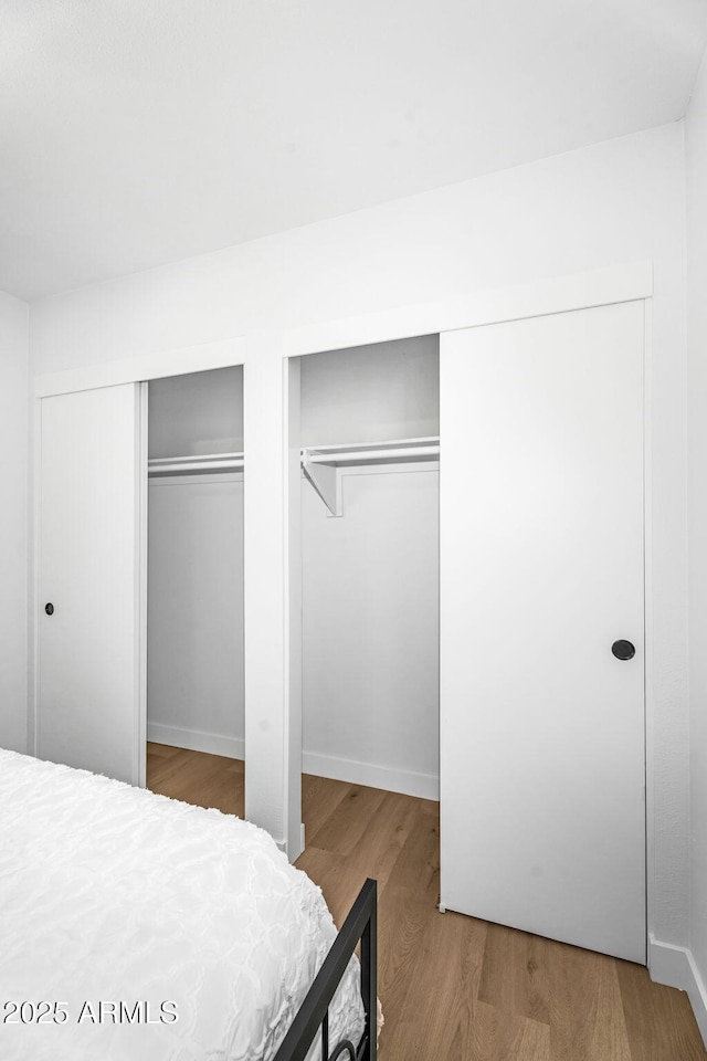 14635 N 37th Pl, Phoenix, AZ 85032 - bedroom featuring multiple closets and wood finished floors