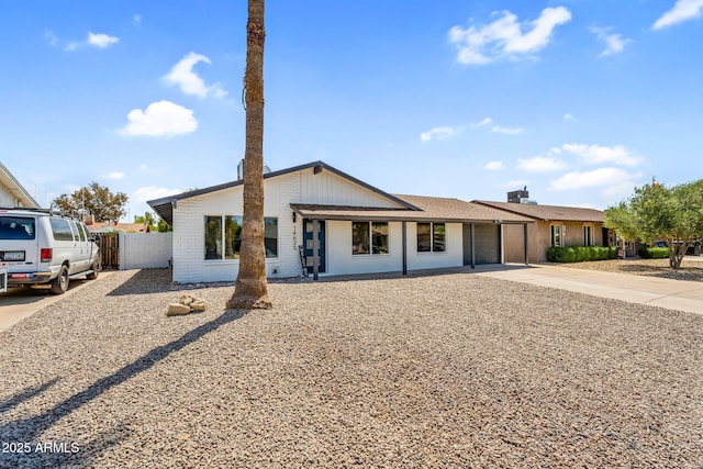 14635 N 37th Pl, Phoenix, AZ 85032 - view of front of home featuring concrete driveway, fence, an attached garage, and brick siding