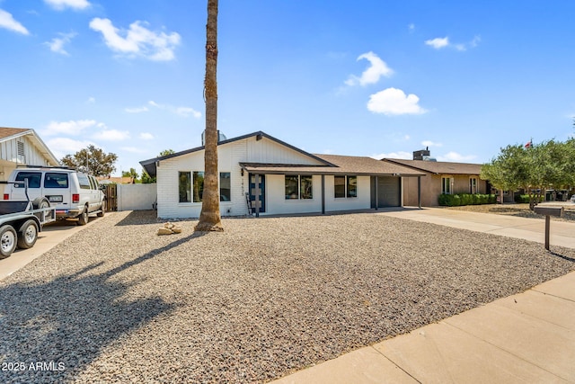 14635 N 37th Pl, Phoenix, AZ 85032 - view of front of home featuring driveway, fence, and a garage