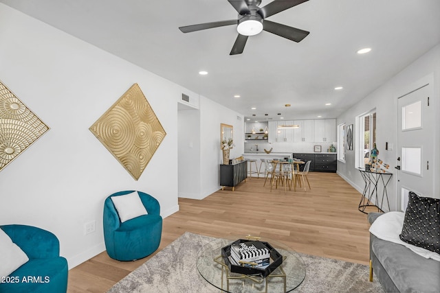 14635 N 37th Pl, Phoenix, AZ 85032 - living area featuring light wood finished floors, recessed lighting, baseboards, and ceiling fan