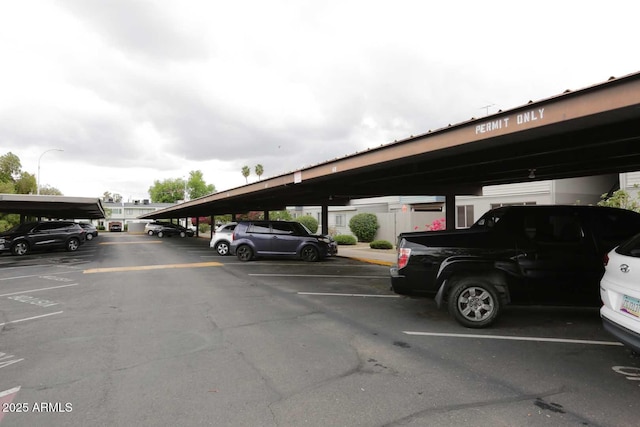 view of vehicle parking with a carport