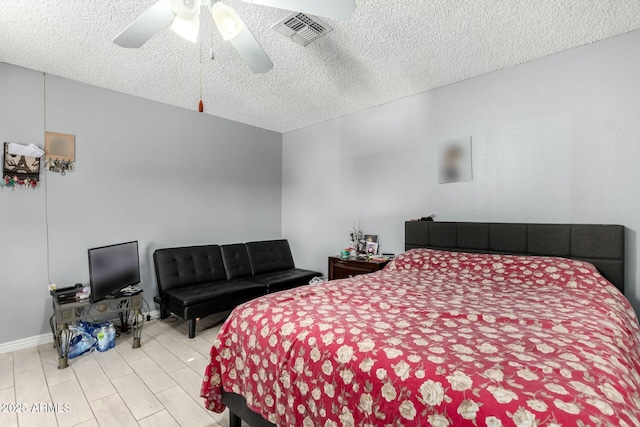 8623 W Indianola Ave, Phoenix, AZ 85037 - bedroom with a ceiling fan, a textured ceiling, visible vents, and baseboards