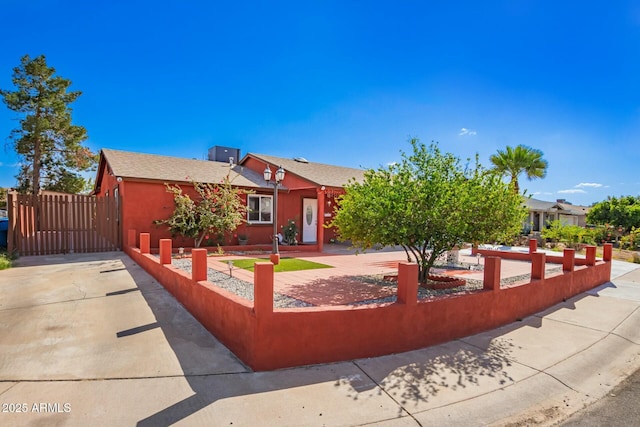 8623 W Indianola Ave, Phoenix, AZ 85037 - view of front facade with stucco siding, cooling unit, and fence private yard