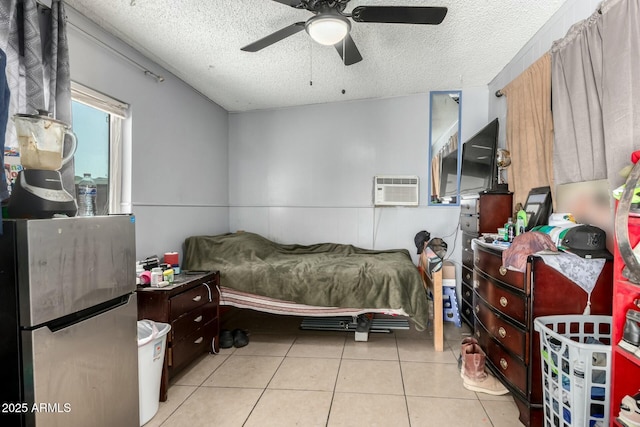 8623 W Indianola Ave, Phoenix, AZ 85037 - bedroom with tile patterned flooring, a textured ceiling, ceiling fan, and a wall mounted AC