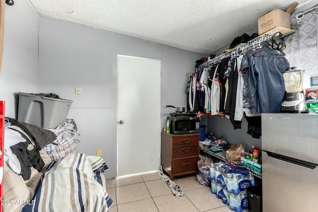 8623 W Indianola Ave, Phoenix, AZ 85037 - walk in closet featuring light tile patterned flooring