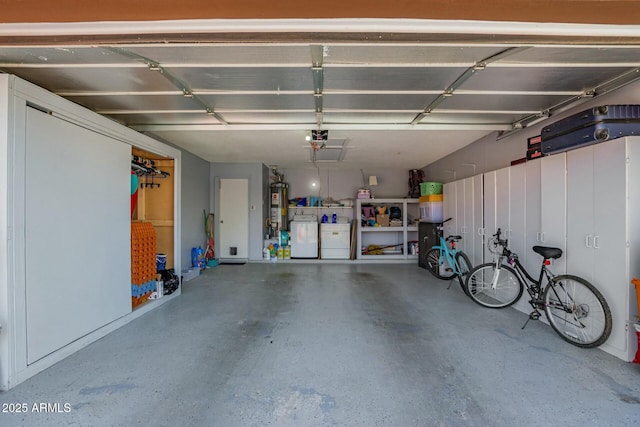 8623 W Indianola Ave, Phoenix, AZ 85037 - garage with a garage door opener, water heater, and washer and dryer