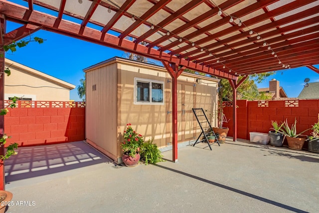 8623 W Indianola Ave, Phoenix, AZ 85037 - view of patio / terrace with an outdoor structure, a pergola, and a fenced backyard