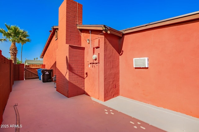 8623 W Indianola Ave, Phoenix, AZ 85037 - entrance to property with a chimney, a gate, brick siding, fence, and a patio
