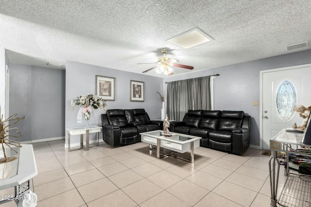 8623 W Indianola Ave, Phoenix, AZ 85037 - living area featuring visible vents, a ceiling fan, baseboards, and light tile patterned floors