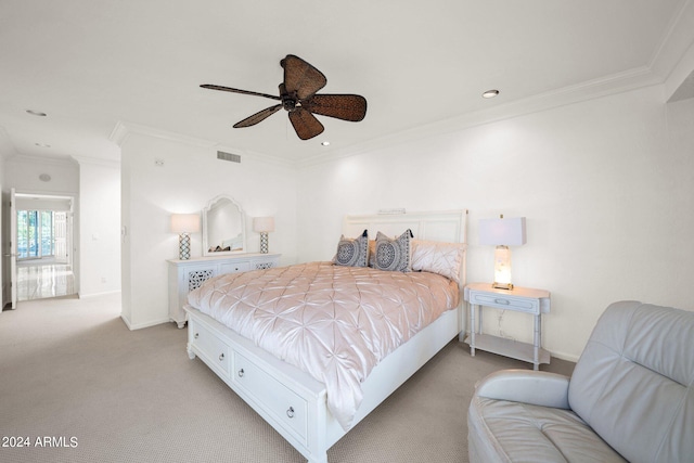 bedroom with crown molding, ceiling fan, and light colored carpet