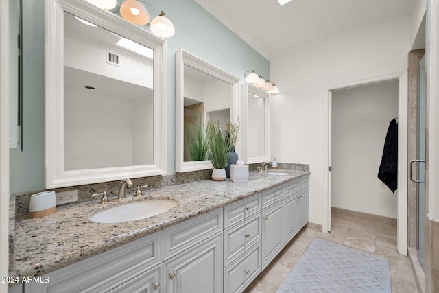 bathroom with tile patterned floors and vanity