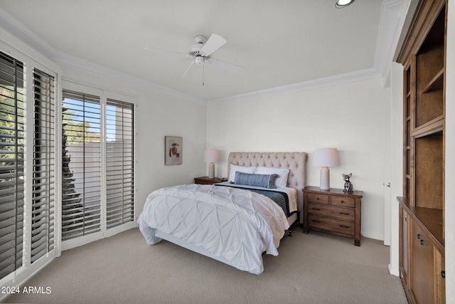 carpeted bedroom featuring ceiling fan and ornamental molding