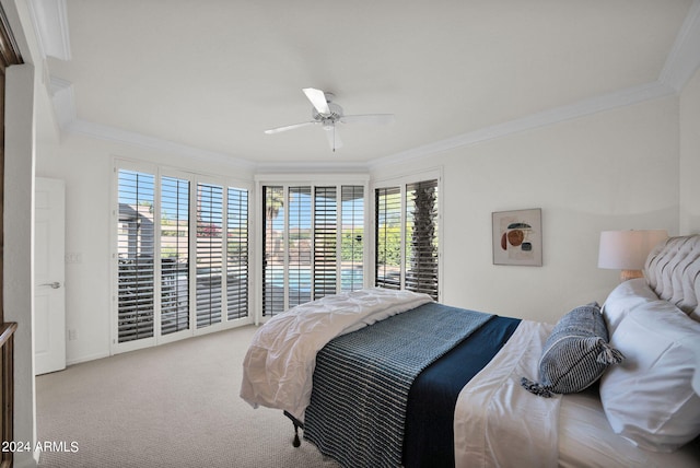 carpeted bedroom with ornamental molding, ceiling fan, and access to outside