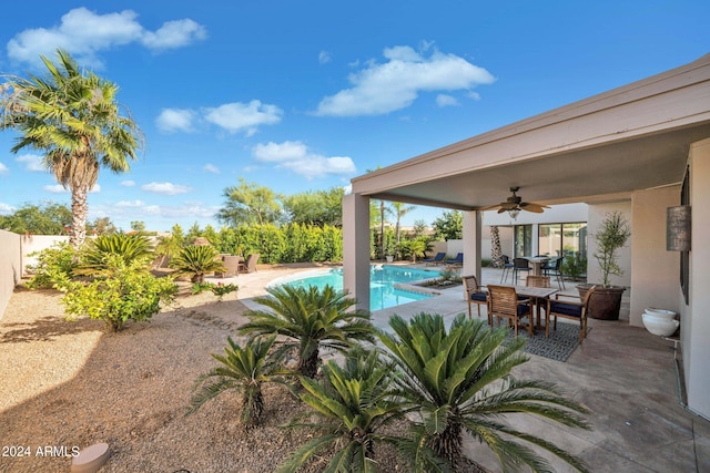 view of pool featuring ceiling fan and a patio area