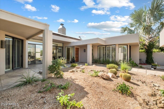 rear view of house with a patio