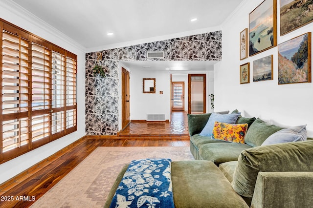 living room with hardwood / wood-style floors and crown molding