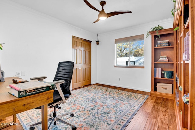 office with ceiling fan, ornamental molding, and wood-type flooring