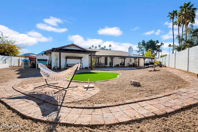 rear view of house with a patio