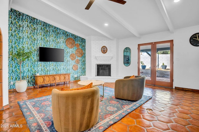 tiled living room featuring a brick fireplace, vaulted ceiling with beams, french doors, and ceiling fan