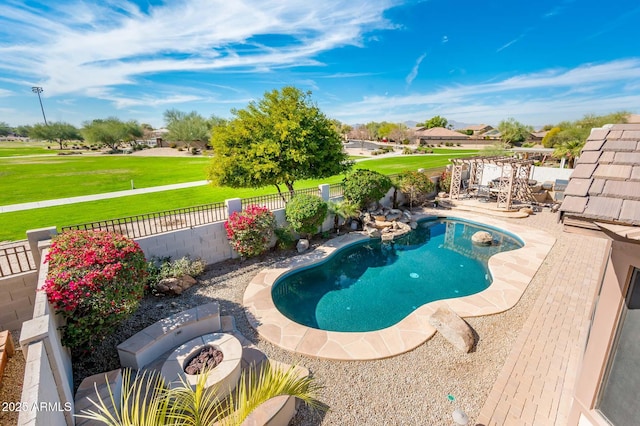 view of swimming pool featuring a patio area and an outdoor fire pit