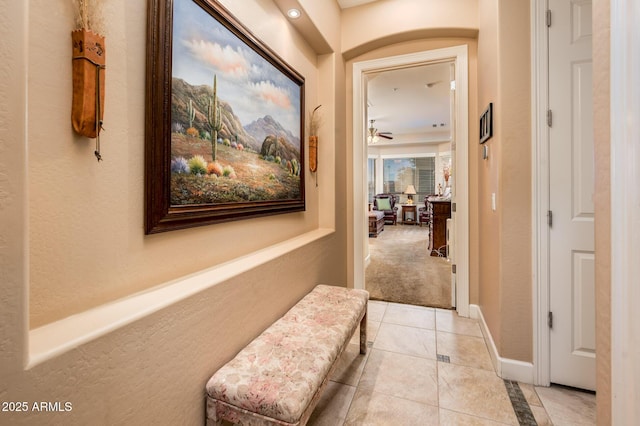 hall with light tile patterned flooring