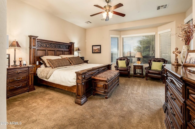 bedroom with a ceiling fan, visible vents, and carpet flooring