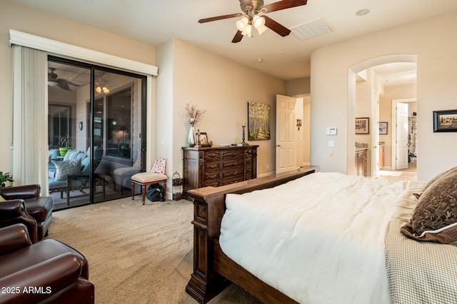 bedroom with access to exterior, light colored carpet, and ceiling fan