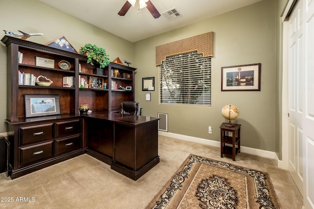 office space with light carpet, ceiling fan, visible vents, and baseboards