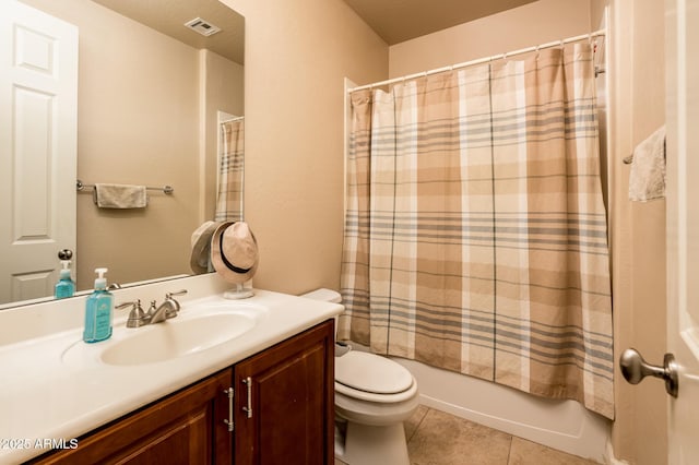 bathroom with tile patterned flooring, toilet, visible vents, vanity, and shower / bath combo