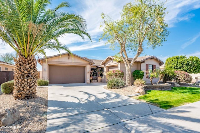 ranch-style home featuring concrete driveway and an attached garage