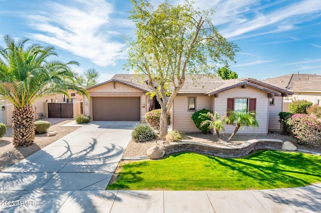 single story home featuring driveway, a garage, fence, and a front lawn