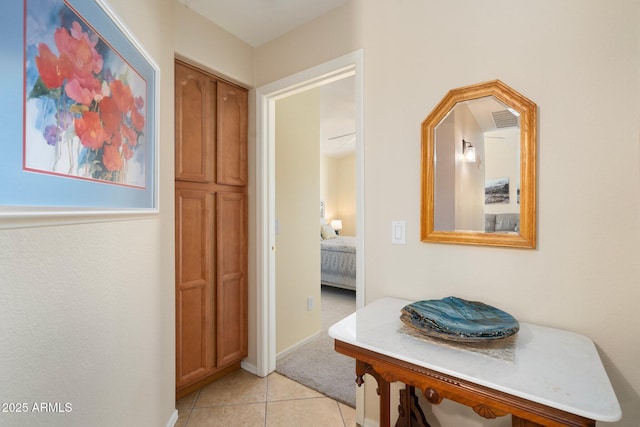 hall with light tile patterned flooring