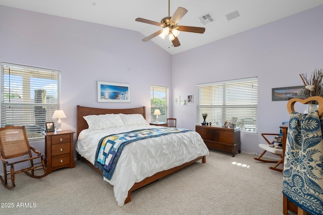 bedroom with ceiling fan, high vaulted ceiling, and light carpet