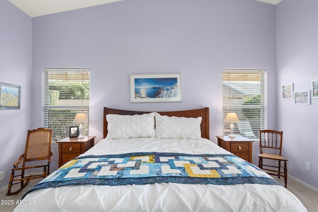 bedroom with carpet flooring and multiple windows