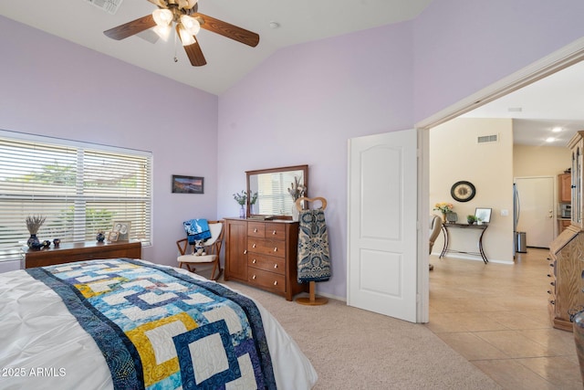 tiled bedroom with ceiling fan, stainless steel fridge, high vaulted ceiling, and multiple windows