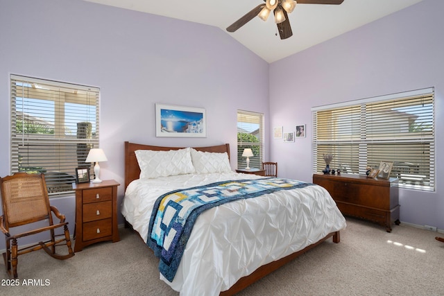 bedroom with light carpet, lofted ceiling, and ceiling fan