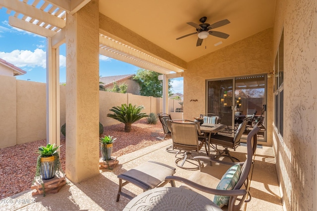 view of patio / terrace with a pergola and ceiling fan