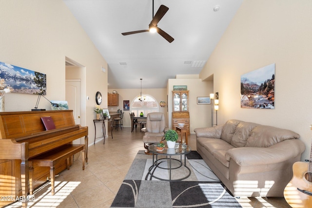 living room with ceiling fan, high vaulted ceiling, and light tile patterned floors