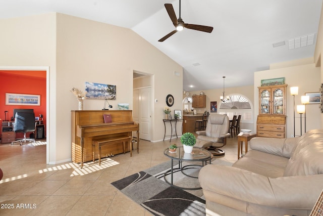 tiled living room with high vaulted ceiling and ceiling fan