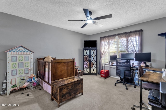 bedroom with ceiling fan, light carpet, and a textured ceiling