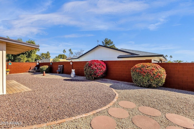 view of side of property featuring a patio